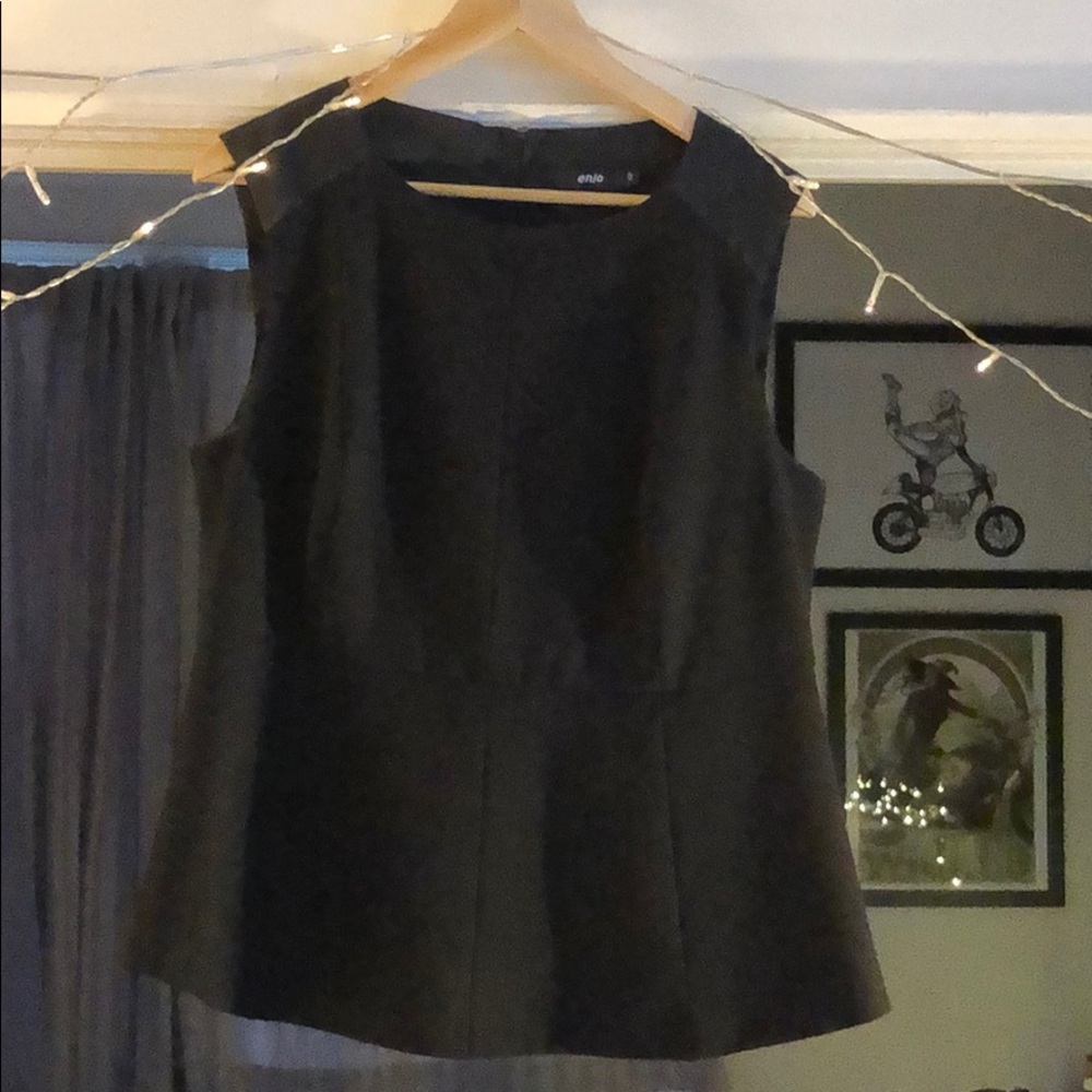 Sleeveless peplum blouse with satin details